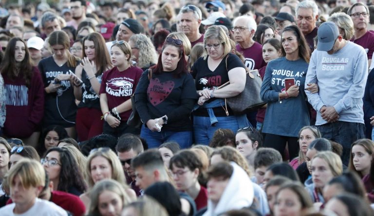 Attendees listen during an interfaith service, Thursday, Feb. 14, 2019, in Parkland, Fla. 