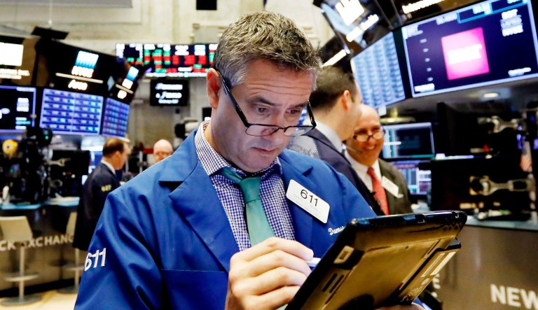 Trader Daniel Trimble works on the floor of the New York Stock Exchange.