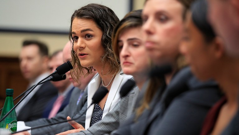 Army Capt. Alivia Stehlik, fourth from right, together with other transgender military members testify about their service before a House Armed Services Subcommittee.