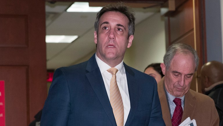 Michael Cohen departs after testifying.