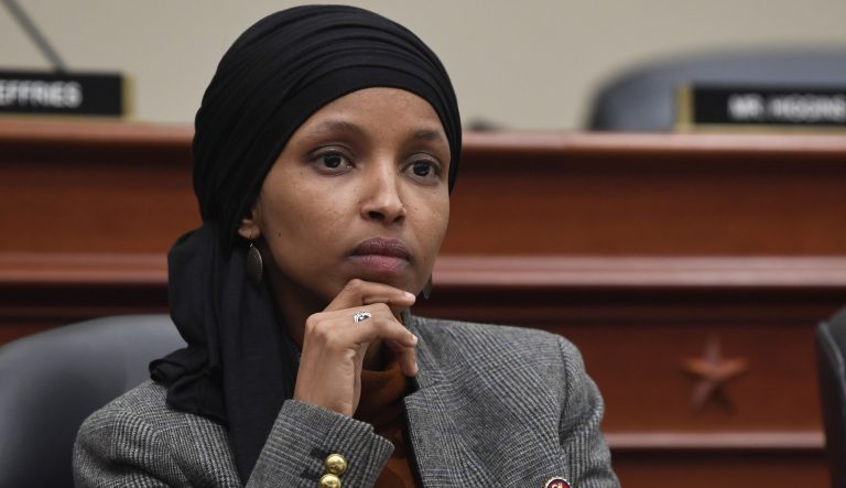 Rep. Ilhan Omar, D-Minn., listens as Office of Management and Budget Acting Director Russell Vought testifies before the House Budget Committee on Capitol Hill in Washington, Tuesday, March 12, 2019, during a hearing on the fiscal year 2020 budget. 