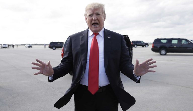 President Donald Trump talks to the media before boarding Air Force One, Sunday, March 24, 2019, at Palm Beach International Airport, in West Palm Beach, Fla., en route to Washington. 