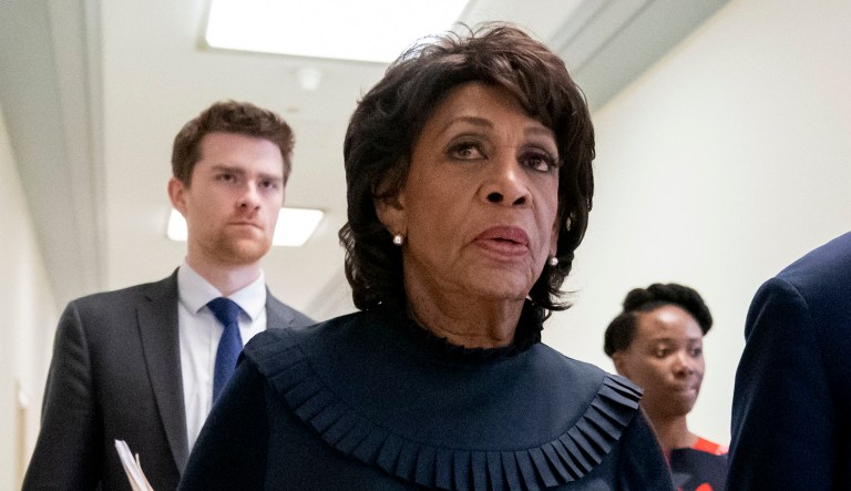 House Financial Services Committee Chairwoman Maxine Waters, D-Calif., walks with staff members on Capitol Hill in D.C.