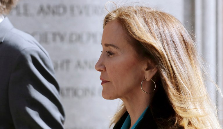 Actress Felicity Huffman arrives at federal court in Boston to face charges in a nationwide college admissions bribery scandal. 