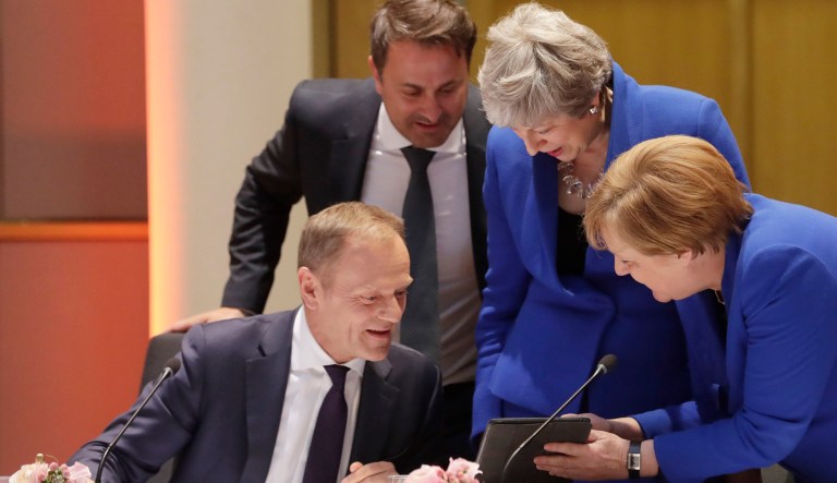 European Council President Donald Tusk, left, speaks with British Prime Minister Theresa May, center right, German Chancellor Angela Merkel, right, and Luxembourg's Prime Minister Xavier Bettel, center left, prior to a dinner during an EU summit in Brussels, Wednesday, April 10, 2019. European Union leaders met Wednesday in Brussels for an emergency summit to discuss a new Brexit extension.