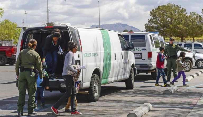 Border Patrol vans drop off migrants at Meerscheidt Recreation Center on Saturday morning, April 13, 2019 in Las Cruces, N.M. 