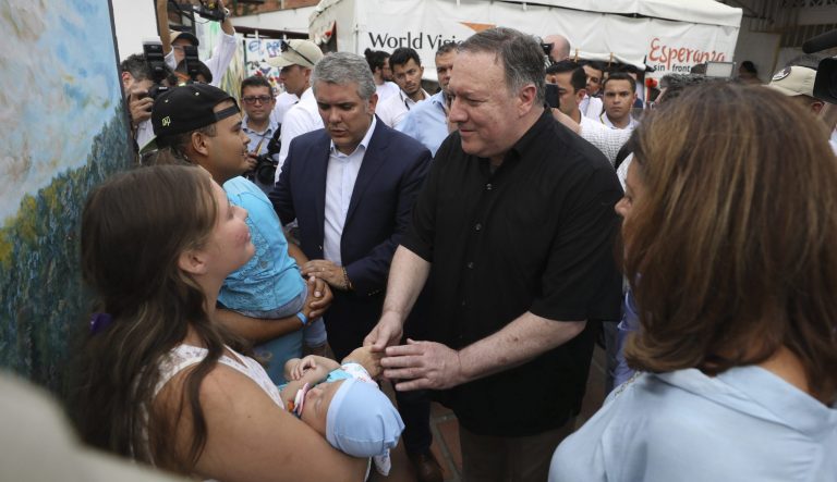 U.S. Secretary of State Mike Pompeo, center right, greets a Venezuelan migrant family who is staying at a migrant shelter, as he's given a tour by Colombian Vice President Marta Lucia Ramirez, right, and Colombian President Ivan Duque, center, in La Parada near Cucuta, Colombia, on the border with Venezuela, Sunday, April 14, 2019. Pompeo is on a four-day Latin American tour, making his final stop at the Colombian border to meet with representatives of Venezuelan refugees. 