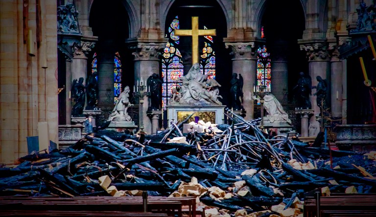 The burnt interior of Notre Dame Cathedral in Paris is shown.