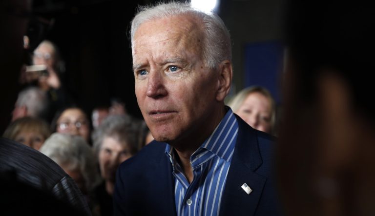 In this May 1, 2019, photo, former Vice President and Democratic presidential candidate Joe Biden greets audience members during a rally in Iowa City, Iowa. 