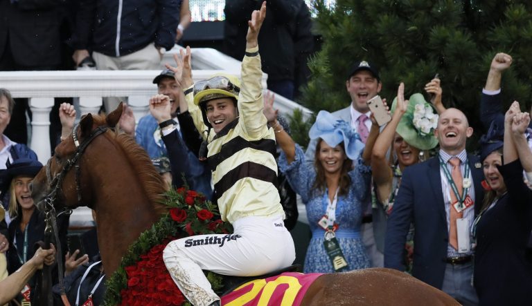 Flavien Prat celebrates after riding Country House to victory during the 145th running of the Kentucky Derby horse race at Churchill Downs Saturday, May 4, 2019, in Louisville, Ky. 
