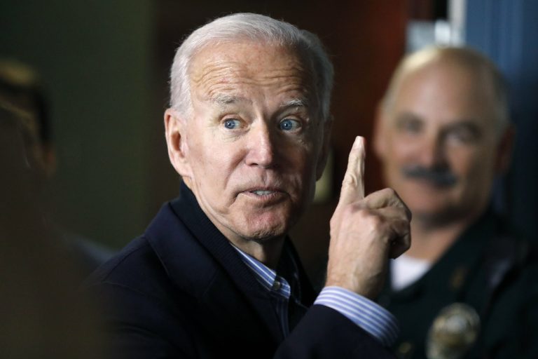 Former vice president and Democratic presidential candidate Joe Biden interacts with a supporter during a campaign stop at the Community Oven restaurant in Hampton, N.H., Monday, May 13, 2019. 