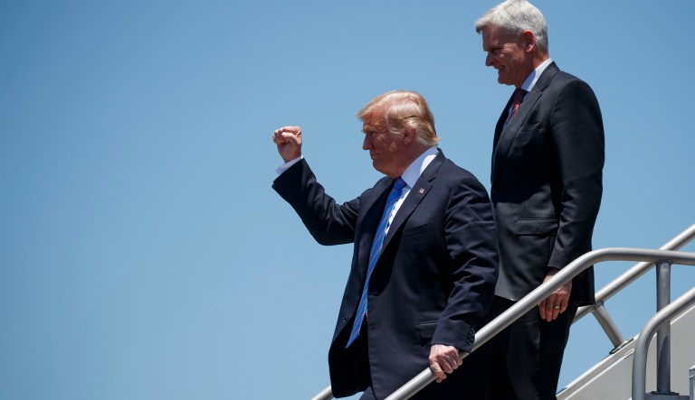 President Donald Trump walks with Sen. Bill Cassidy, R-La., after arriving at Chennault International Airport, Tuesday, May 14, 2019, in Lake Charles, La.