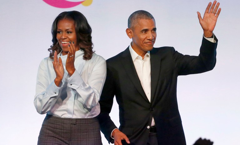 In this Oct. 31, 2017 photo, former President Barack Obama, right, and former first lady Michelle Obama appear at the Obama Foundation Summit in Chicago. 