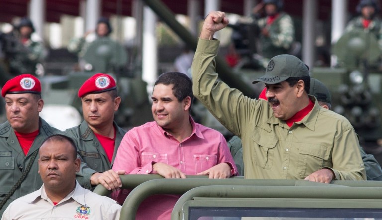 Nicolas Maduro Jr., center, accompanies his father, Venezuela's President Nicolas Maduro in a military parade, in Caracas, Venezuela.