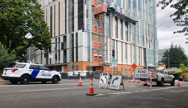 A road closure sign is seen in downtown Portland, Ore., Friday, Aug. 16, 2019, in advance of a rally as the city prepares for crowds. In the past week, authorities in Portland have arrested a half-dozen members of right-wing groups on charges related to violence at previous politically motivated rallies as the liberal city braces for potential clashes between far-right groups and self-described anti-fascists who violently oppose them.