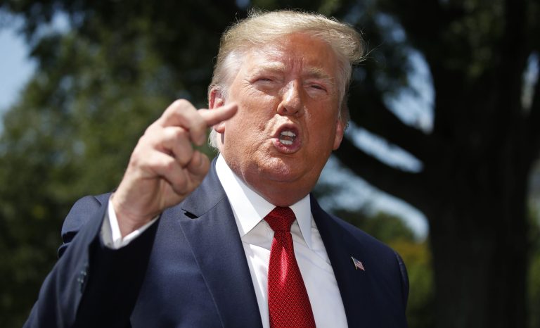 President Donald Trump speaks with reporters before departing on Marine One on the South Lawn of the White House, Wednesday, Aug. 21, 2019, in Washington. Trump is headed to Kentucky. 
