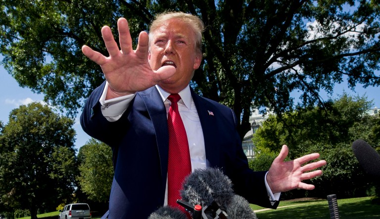 President Trump speaks with reporters.