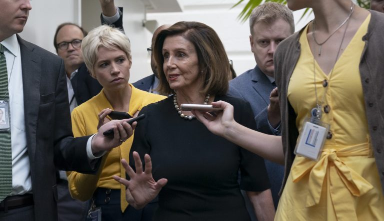 Speaker of the House Nancy Pelosi, D-Calif., is surrounded by reporters as she arrives to meet with her caucus the morning after declaring she will launch a formal impeachment inquiry against President Donald Trump, at the Capitol in Washington, Wednesday, Sept. 25, 2019. 