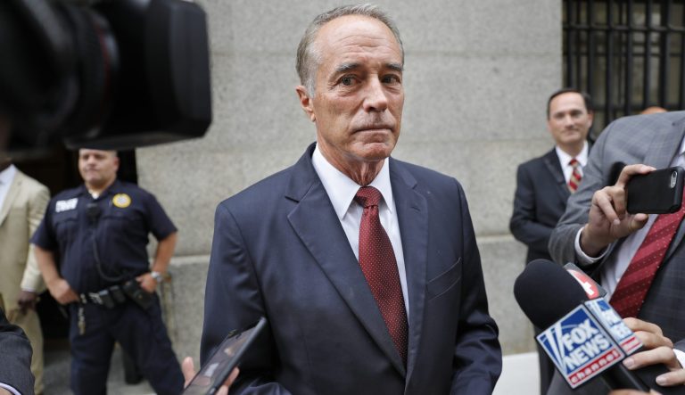In this Sept. 12, 2019 photo, U.S. Rep. Chris Collins, R-N.Y., speaks to reporters as he leaves the courthouse after a pretrial hearing in his insider-trading case, in New York. 