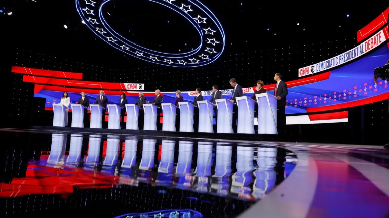 From left, Rep. Tulsi Gabbard, D-Hawaii, businessman Tom Steyer, Sen. Cory Booker, D-N.J., Sen. Kamala Harris, D-Calif., Sen. Bernie Sanders, I-Vt., former Vice President Joe Biden, Sen. Elizabeth Warren, D-Mass., South Bend Mayor Pete Buttigieg, entrepreneur Andrew Yang, former Texas Rep. Beto O'Rourke, Sen. Amy Klobuchar, D-Minn., and former Housing Secretary Julian Castro participate in a Democratic presidential primary debate hosted by CNN/New York Times at Otterbein University, Tuesday, Oct. 15, 2019, in Westerville, Ohio. 