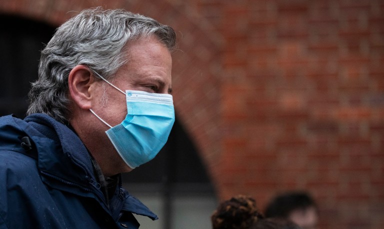 Mayor Bill de Blasio wears a mask during a 7 o'clock ceremony to honor healthcare workers at Brooklyn's Kings County Hospital Center during the new coronavirus pandemic, Friday, April 24, 2020, in New York. 