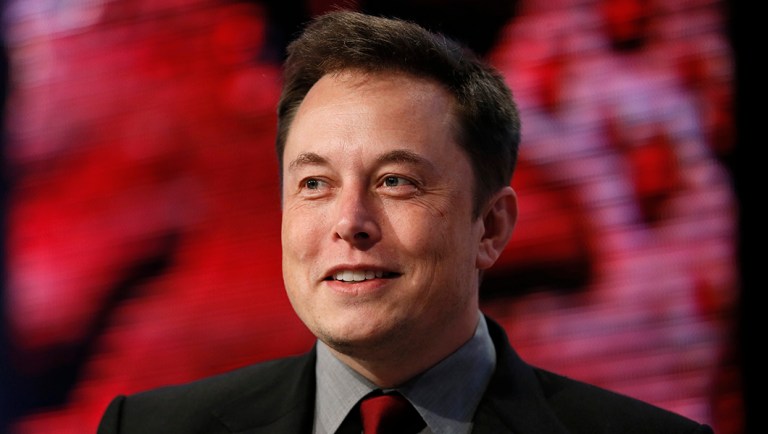 Elon Musk speaks at the Automotive News World Congress.