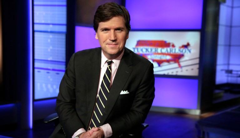 Tucker Carlson, host of "Tucker Carlson Tonight," poses for photos in a Fox News Channel studio, in New York, Thursday, March 2, 2017.