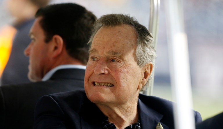 Former President George H. W. Bush is seen before an NFL football game between the Houston Texans and the Jacksonville Jaguars Sunday, Nov. 24, 2013, in Houston.