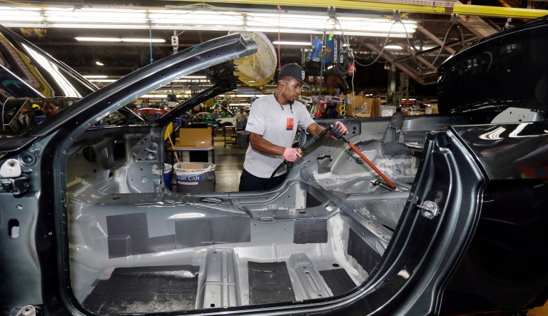 United Auto Workers assemblyman Mark Williams works on the Ford Mustang at the Flat Rock Assembly Plant, Thursday, Aug. 20, 2015, in Flat Rock, Mich. 