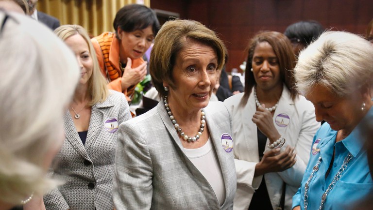 House Minority Leader Nancy Pelosi, of Calif., center, talks with a group of women following her appearance at a forum on the women's economics agenda.
