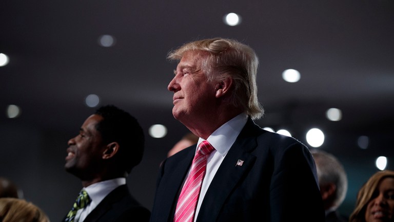 Republican presidential candidate Donald Trump looks on during a church service at Great Faith Ministries, Saturday, Sept. 3, 2016, in Detroit.