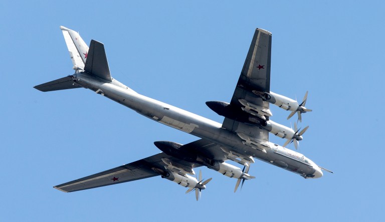 A Russian Tu-95 strategic bomber flies in the air.