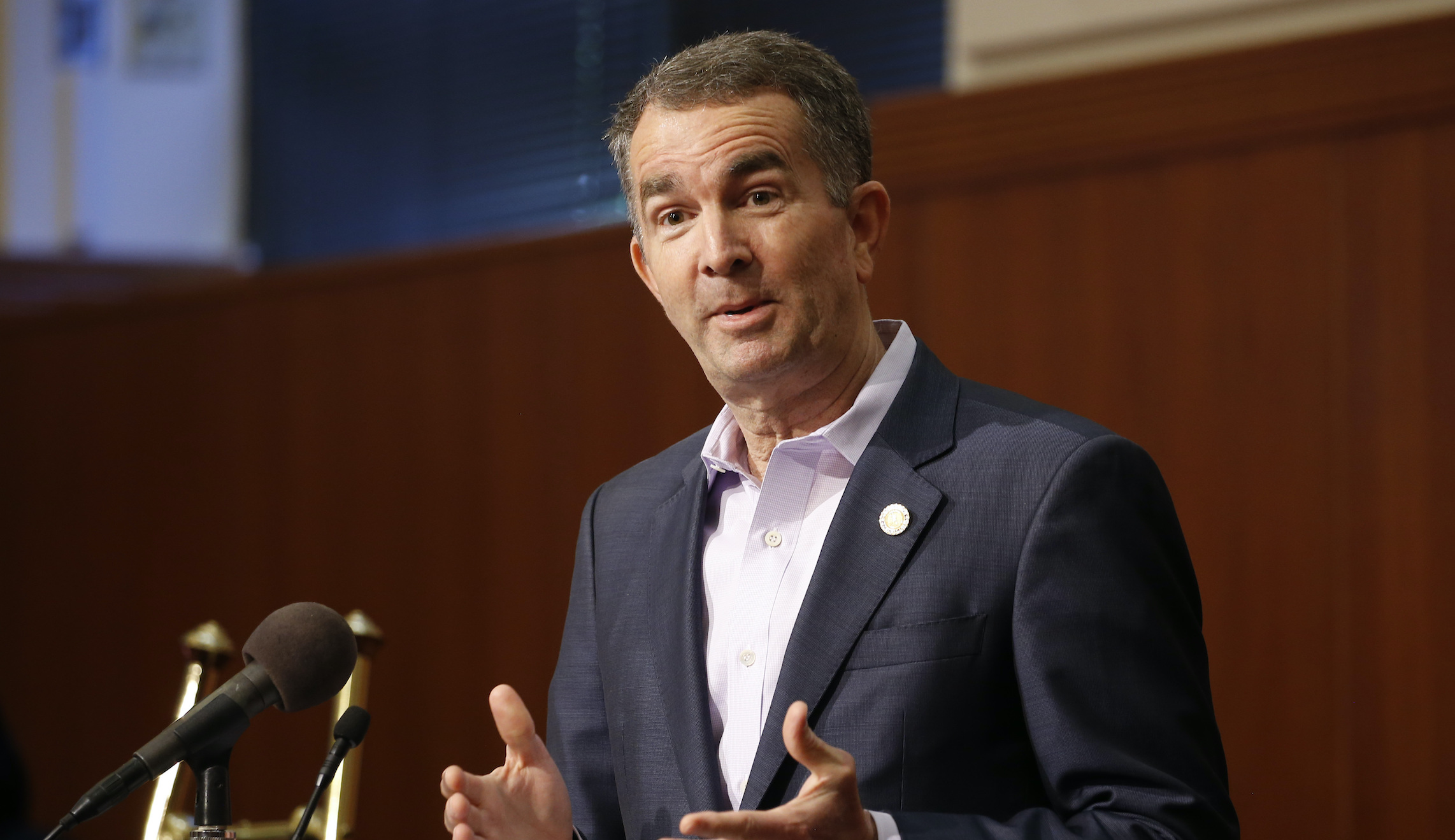 Virginia governor ceremoniously signs several gun control bills