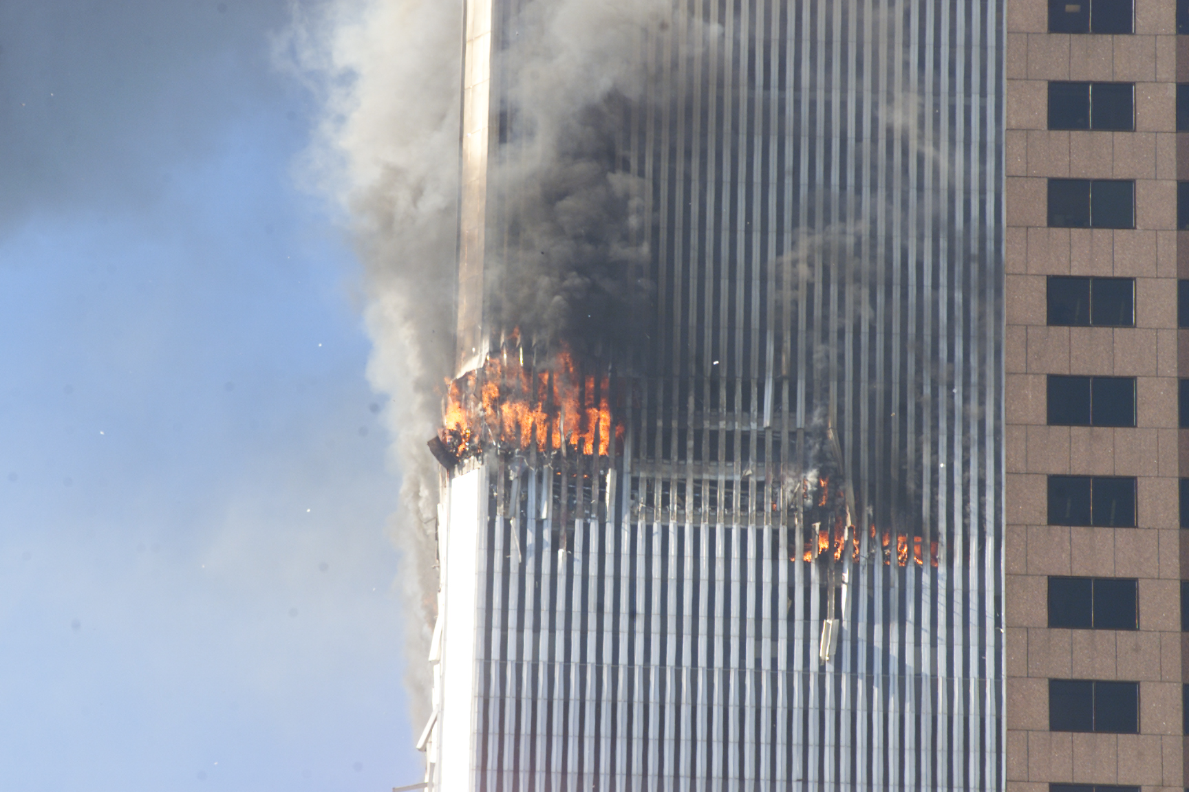 Debris fall from one of the burning twin towers of the World Trade Center.
