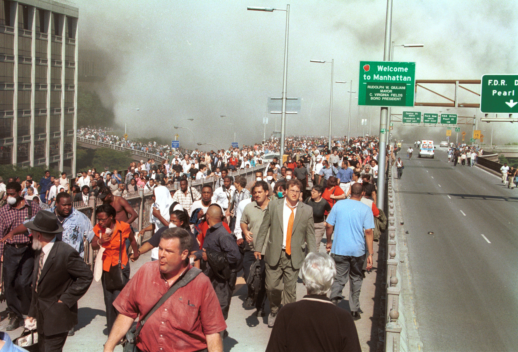 People flee lower Manhattan across the Brooklyn Bridge.