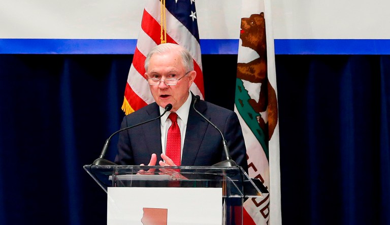 Attorney General Jeff Sessions addresses the California Peace Officers' Association. The Trump administration is suing California over a law that aims to give the state power to override the sale of federal lands. 