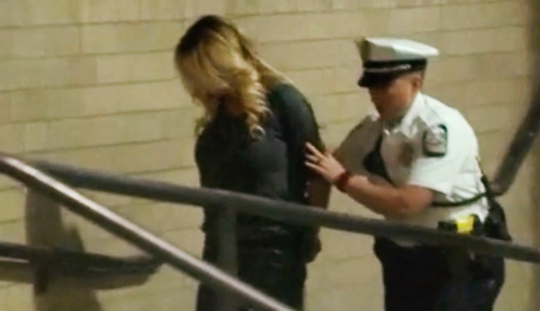 Porn actress Stormy Daniels is led into jail in Columbus, Ohio., after being taken into custody during a Wednesday evening show. Daniels was arrested at a strip club and is accused of letting patrons touch her in violation of a state law, her attorney said. 