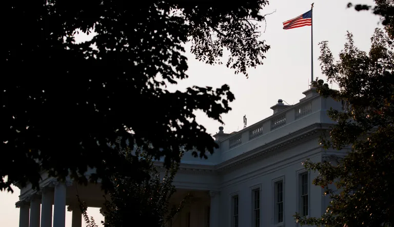 An American flag above the White House flies at full-staff less than 48 hours after the death of Sen. John McCain in Washington. 