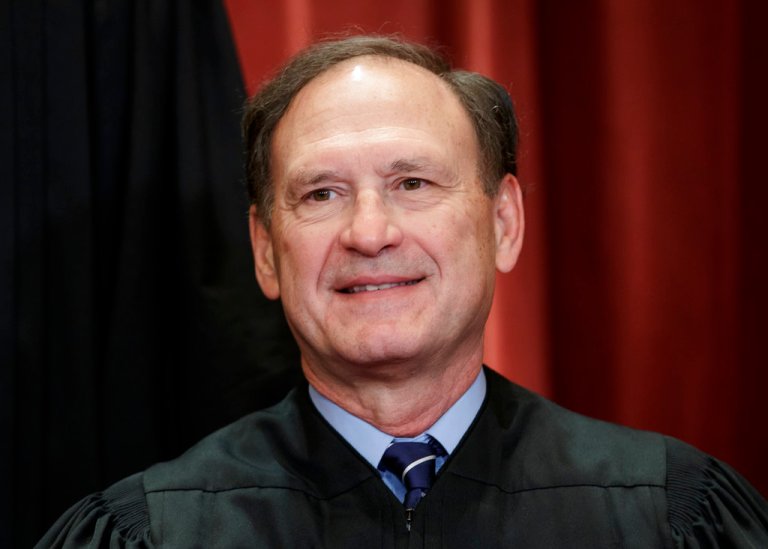 Associate Justice Samuel Alito Jr., nominated by President George W. Bush, sits with fellow Supreme Court justices for a group portrait at the Supreme Court Building in Washington, Friday, Nov. 30, 2018. 