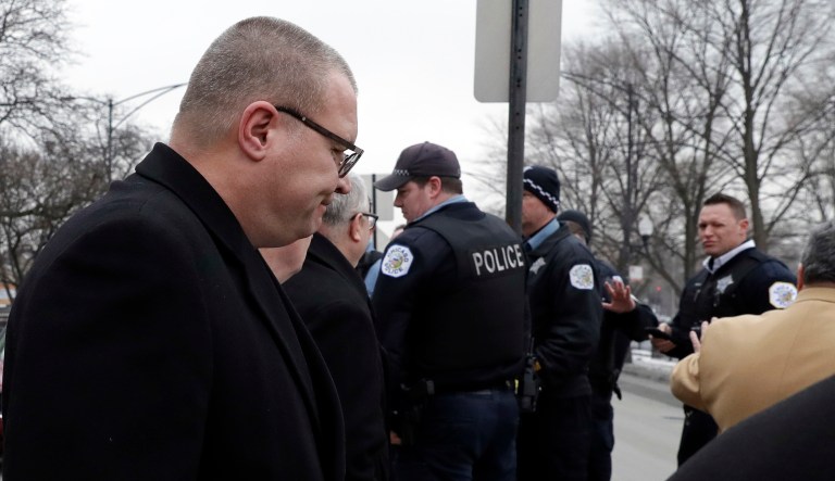 Former Detective David March, left, leaves the courthouse Thursday, Jan. 17, 2019, in Chicago. March, ex-Officer Joseph Walsh and Officer Thomas Gaffney, three Chicago police officers accused of trying to cover up the fatal shooting of Laquan McDonald by officer Jason Van Dyke in October 2014, were acquitted by a judge on Thursday.