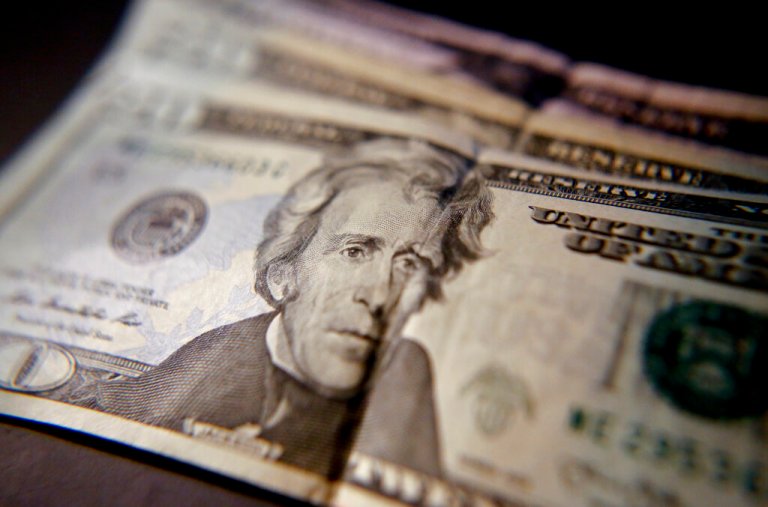 $20 bills are shown in a picture.