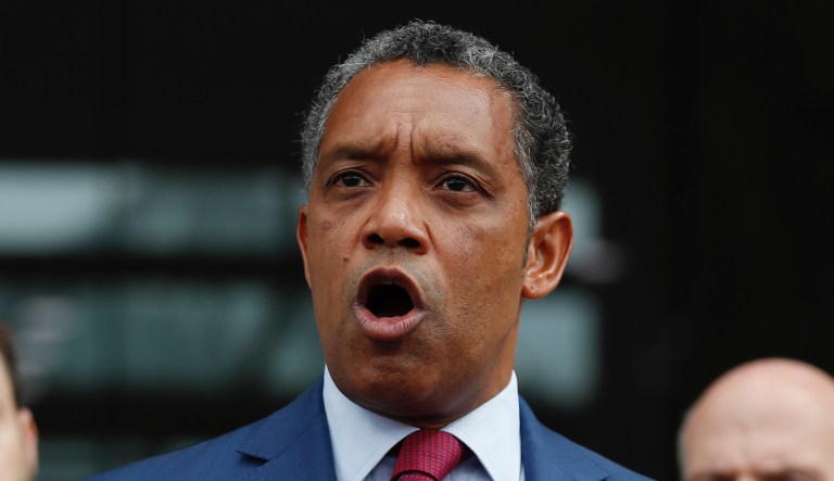 District of Columbia Attorney General Karl Racine, joined by from left, District of Columbia Council member Charles Allen and District of Columbia Council Chairman Phil Mendelson, speaks at One Judiciary Square in Washington, Thursday, Oct. 5, 2017. 