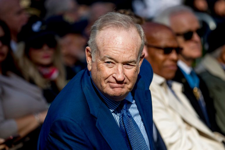 FILE - In this Nov. 11, 2019, file photo, Bill O'Reilly, right, arrives before President Donald Trump and first lady Melania Trump participate in a wreath laying ceremony at the New York City Veterans Day Parade at Madison Square Park in New York.