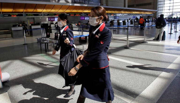 Italian flight attendants strip clothing to protest job conditions