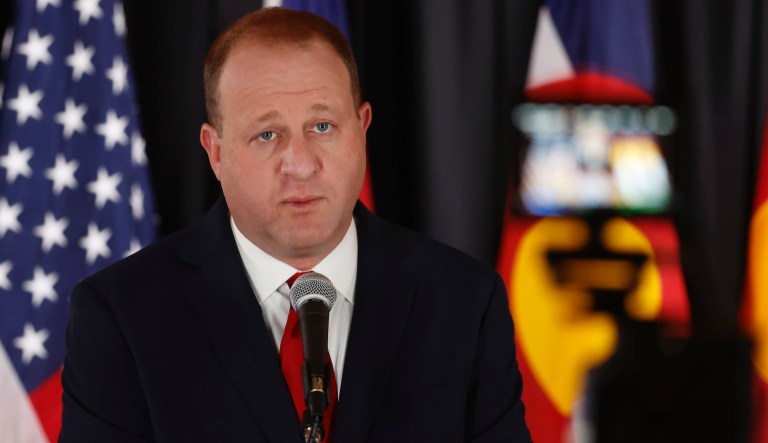 Colorado Gov. Jared Polis makes a point during a news conference to update the stateâs efforts to check the spread of the new coronavirus Monday, May 11, 2020, in Denver. Polis announced that a restaurant in Castle Rock, Colo., that opened Sunday in defiance of state rules barring in-person dining will have its business license suspended temporarily for the action. (AP Photo/David Zalubowski)