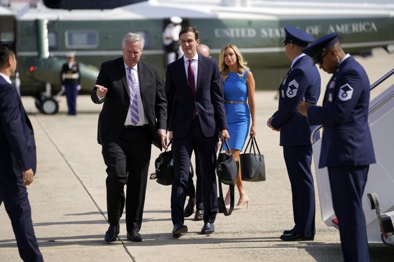 White House Chief of Staff Mark Meadows, second from left, talks with White House adviser Jared Kushner, third from left, as walk towards Air Force One to travel with President Donald Trump, Tuesday, June 23, 2020, in Andrews Air Force Base, Md. White House press secretary Kayleigh McEnanyis walks third from right. The Trump staff is leaner than the past Obama team.