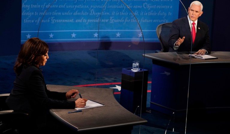 Vice President Mike Pence looks at Democratic vice presidential candidate Sen. Kamala Harris, D-Calif., as he answers a question during the vice presidential debate Wednesday, Oct. 7, 2020, at Kingsbury Hall on the campus of the University of Utah in Salt Lake City. (AP Photo/Morry Gash, Pool)