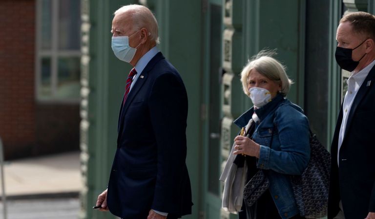 Then Democratic presidential candidate former Vice President Joe Biden and Anita Dunn center, depart The Queen theatre in Wilmington, Del.