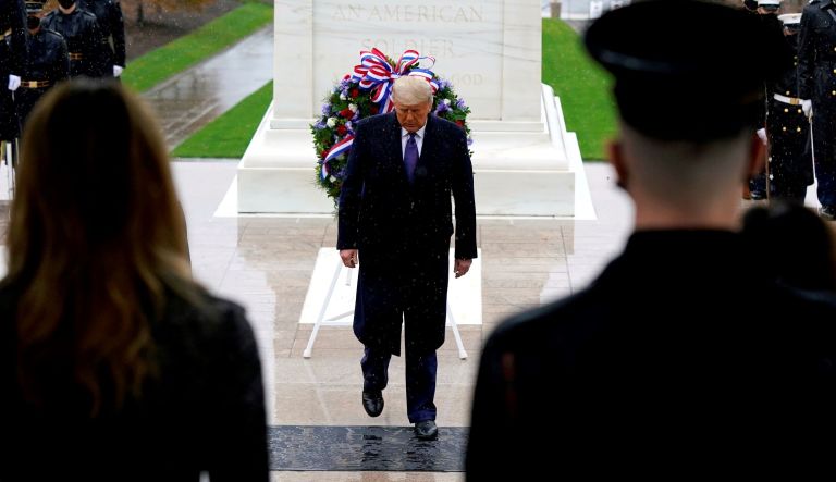 President Donald Trump participates in a wreath laying ceremony on Veterans Day at Arlington National Cemetery in Arlington, Va., Wednesday, Nov. 11, 2020.