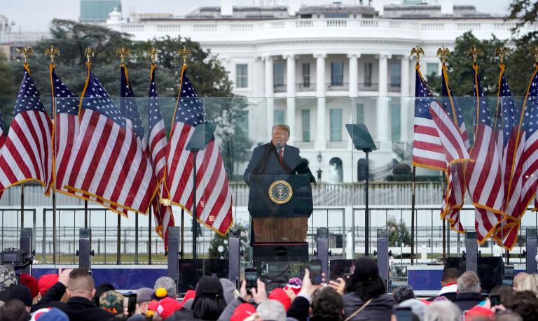 With the White House in the background, President Donald Trump speaks at a rally Wednesday, Jan. 6, 2021, in Washington.
